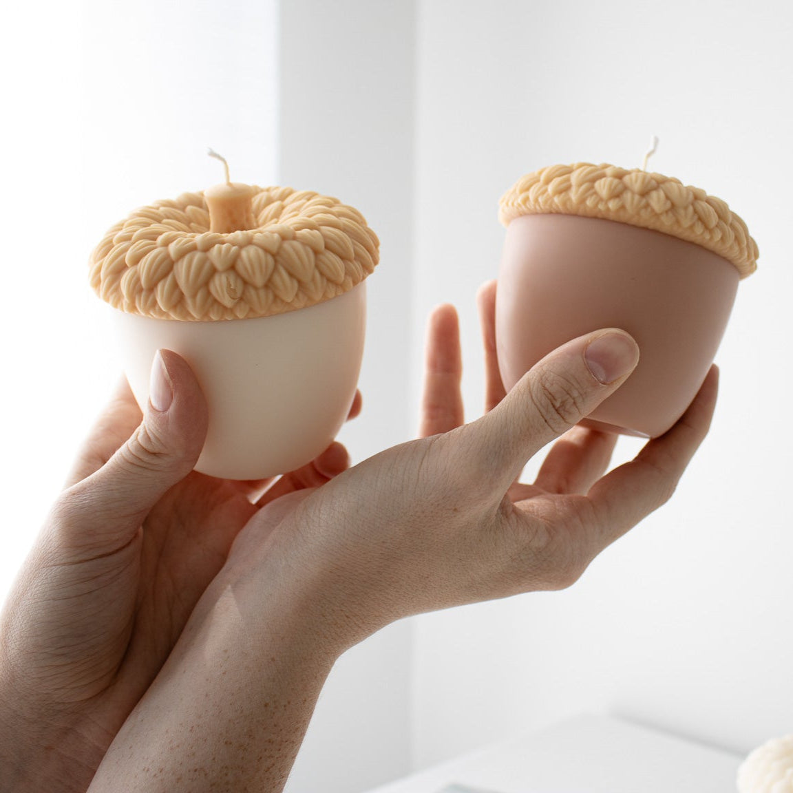 Acorn-shaped soy candle in warm autumn colors