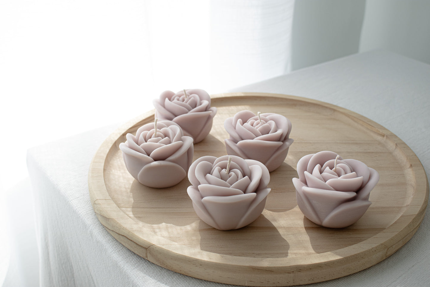 lavender colored  decorative floral candles