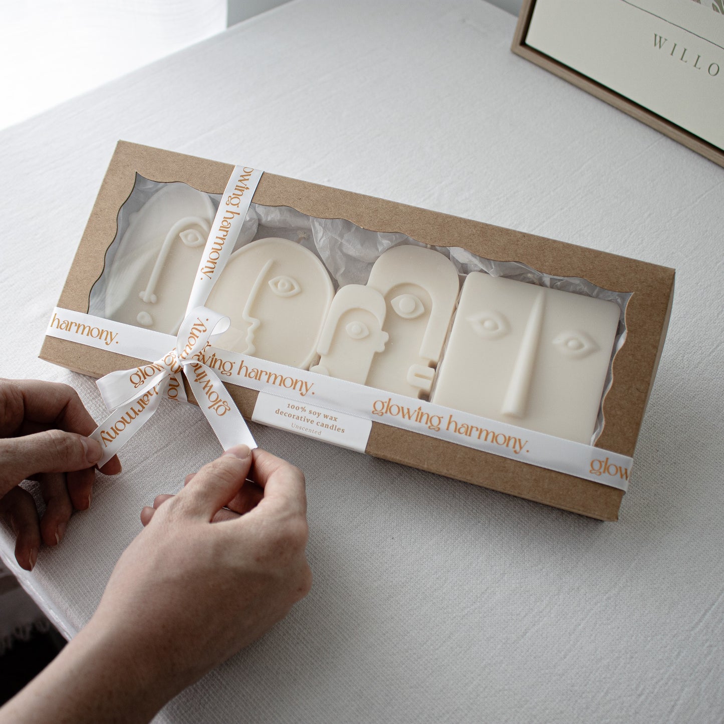 Set of face-shaped candles in a gift box