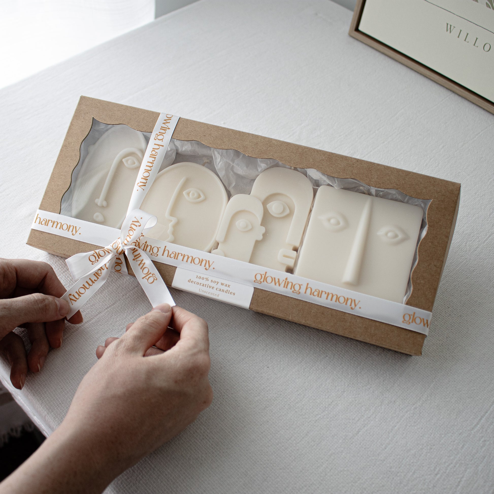 Set of face-shaped candles in a gift box