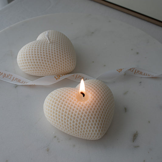 cream white textured heart shaped candle