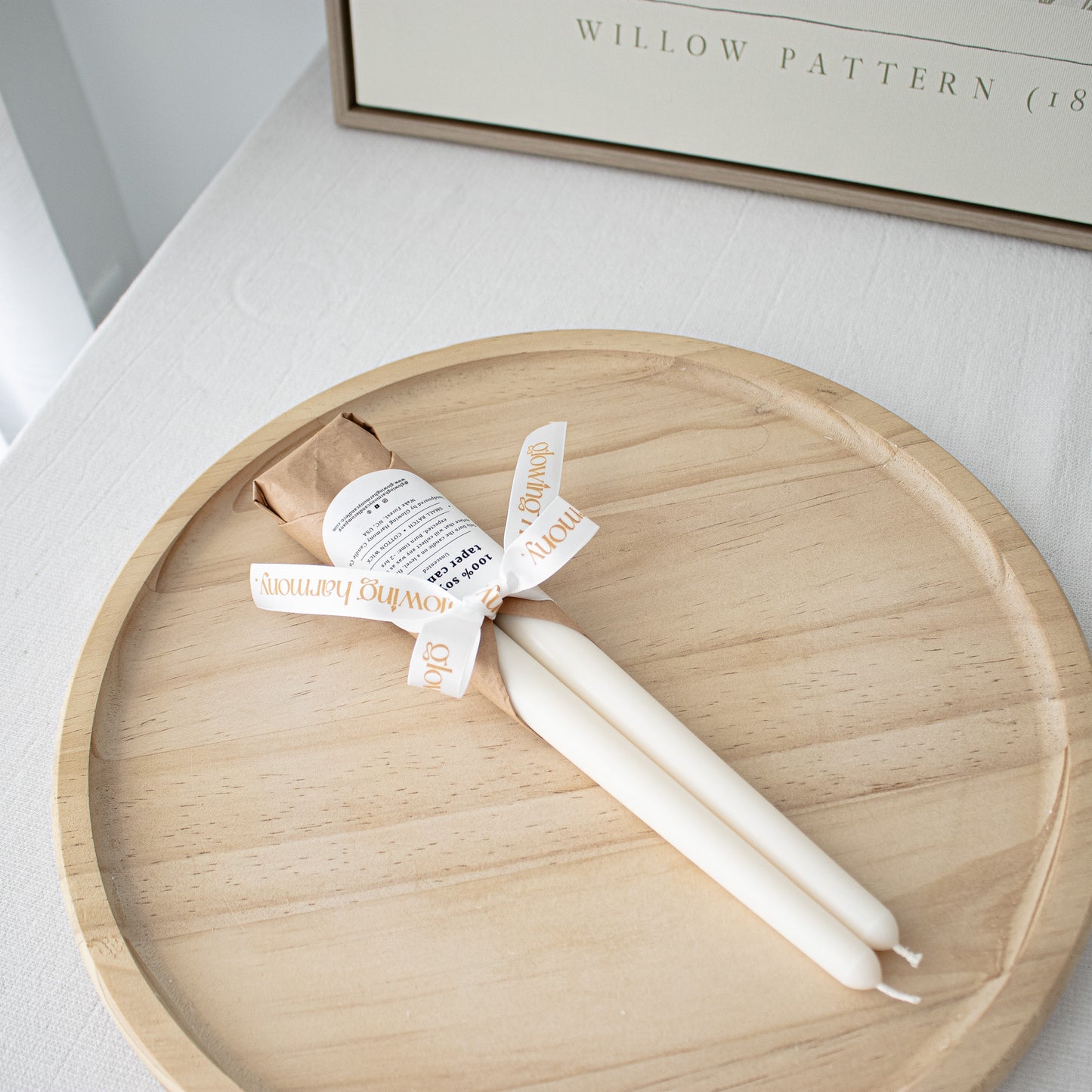 classic handmade taper candles unscented wrapped in tissue paper and tied with a ribbon