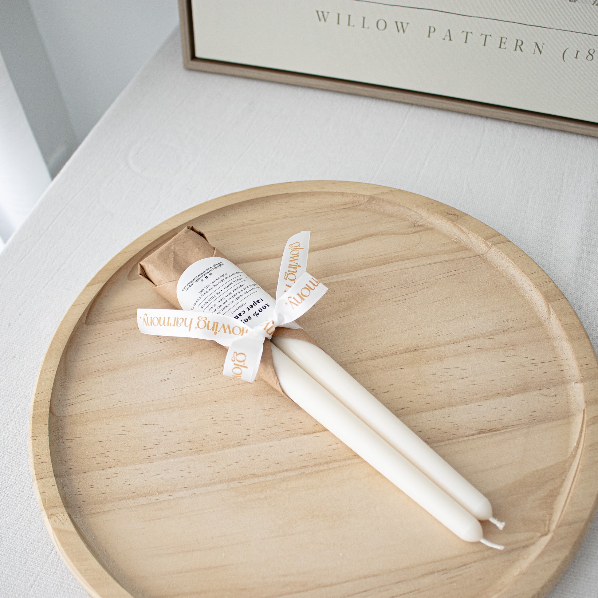 classic handmade taper candles unscented wrapped in tissue paper and tied with a ribbon
