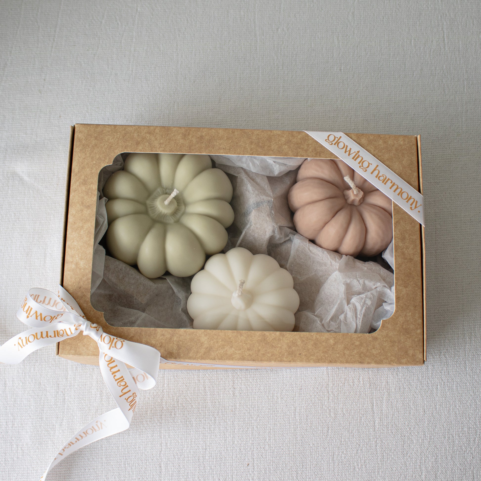 Autumn-themed pumpkin candle set packaged for gifting