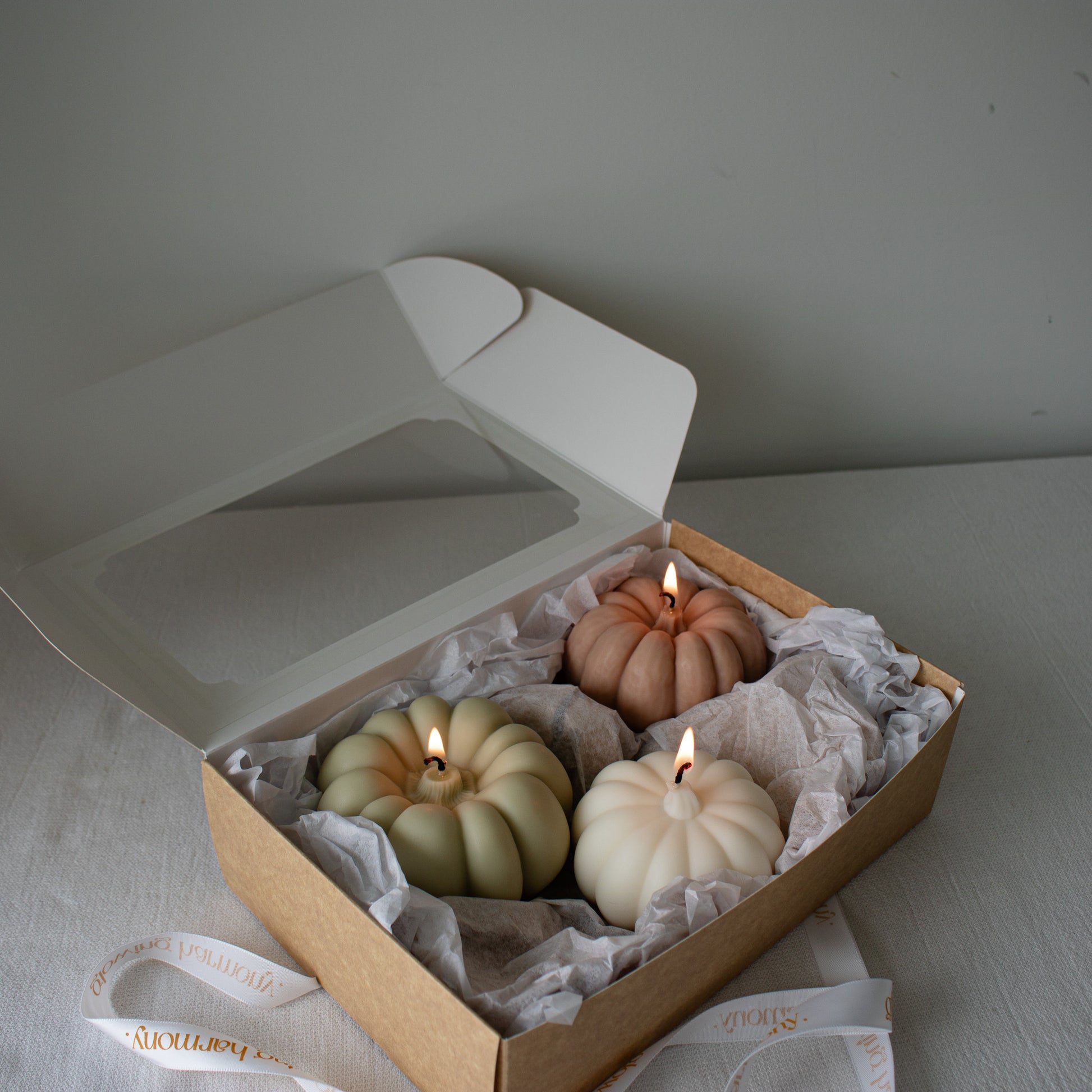 Seasonal soy candles shaped like pumpkins, boxed for gifting