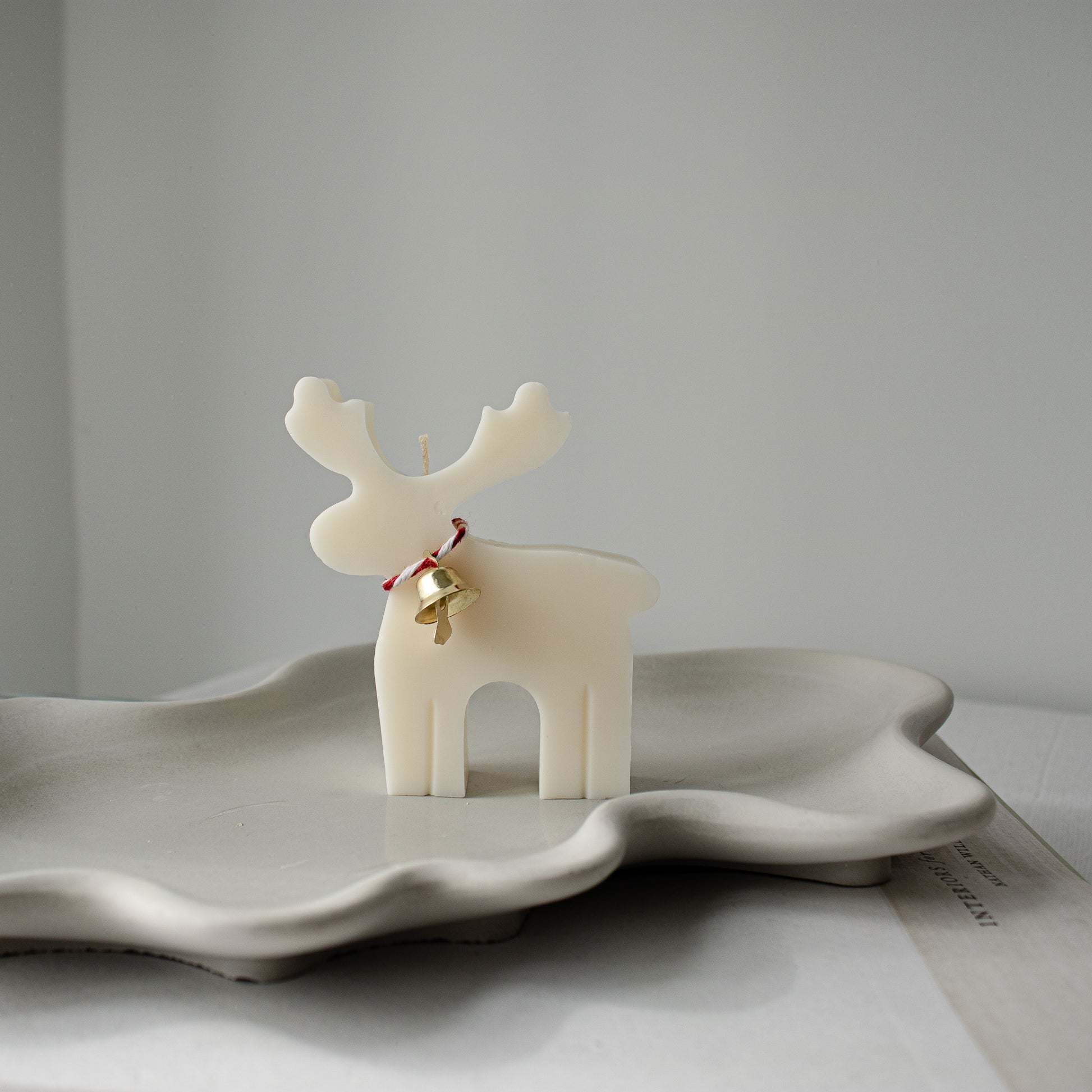 cream white decorative candle for the holiday season