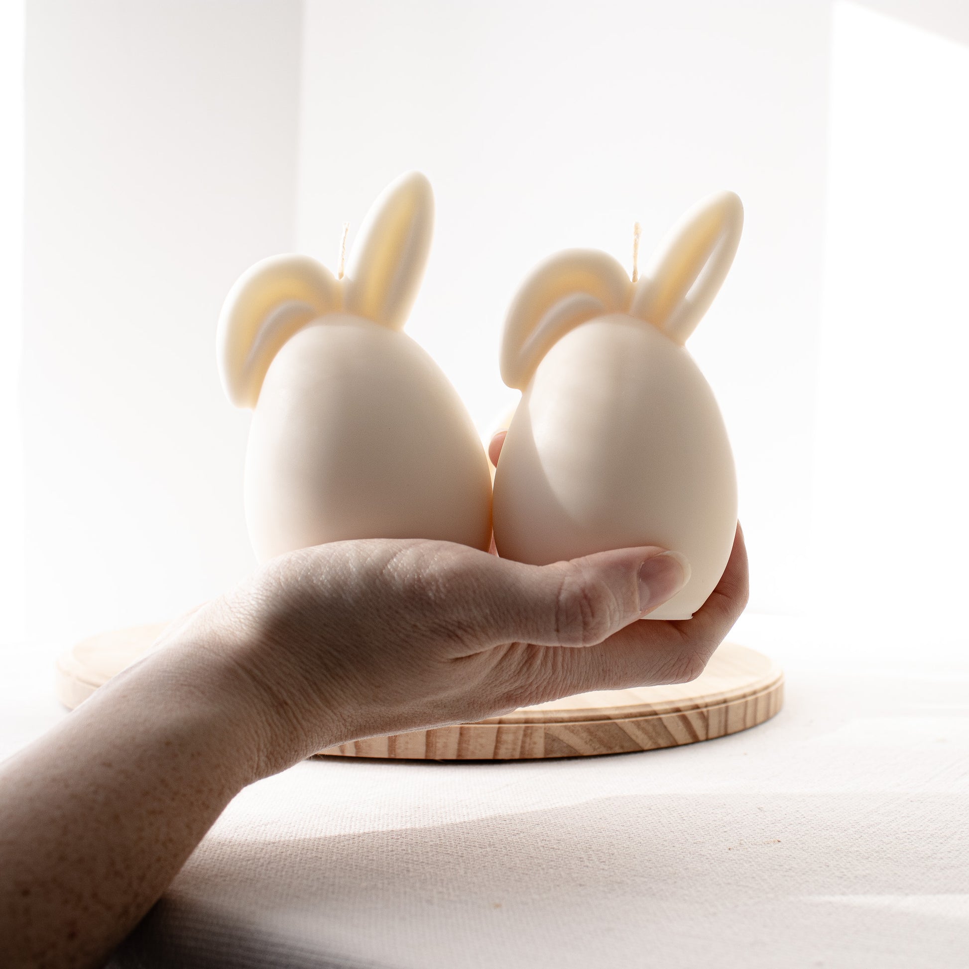 Two white rabbit-shaped candles 
