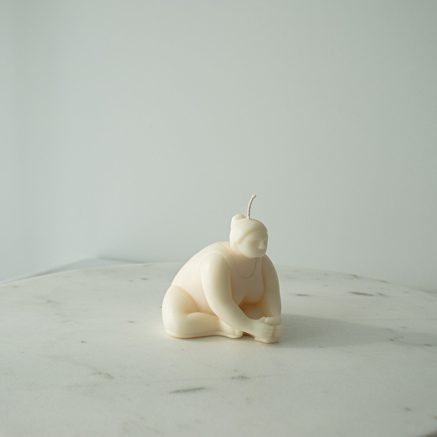 cream white decorative candle for yoga lovers