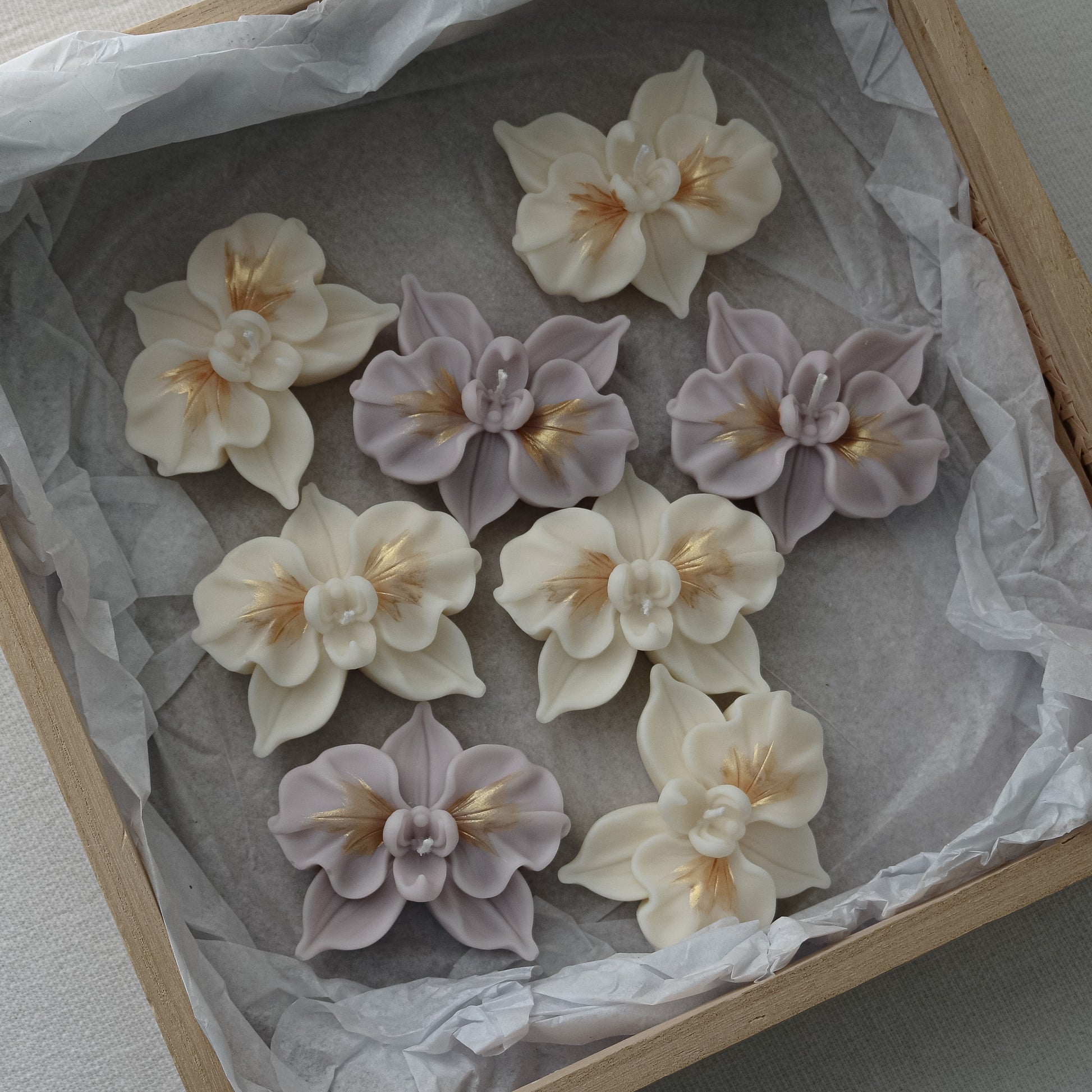 cream white and purple flower candles 