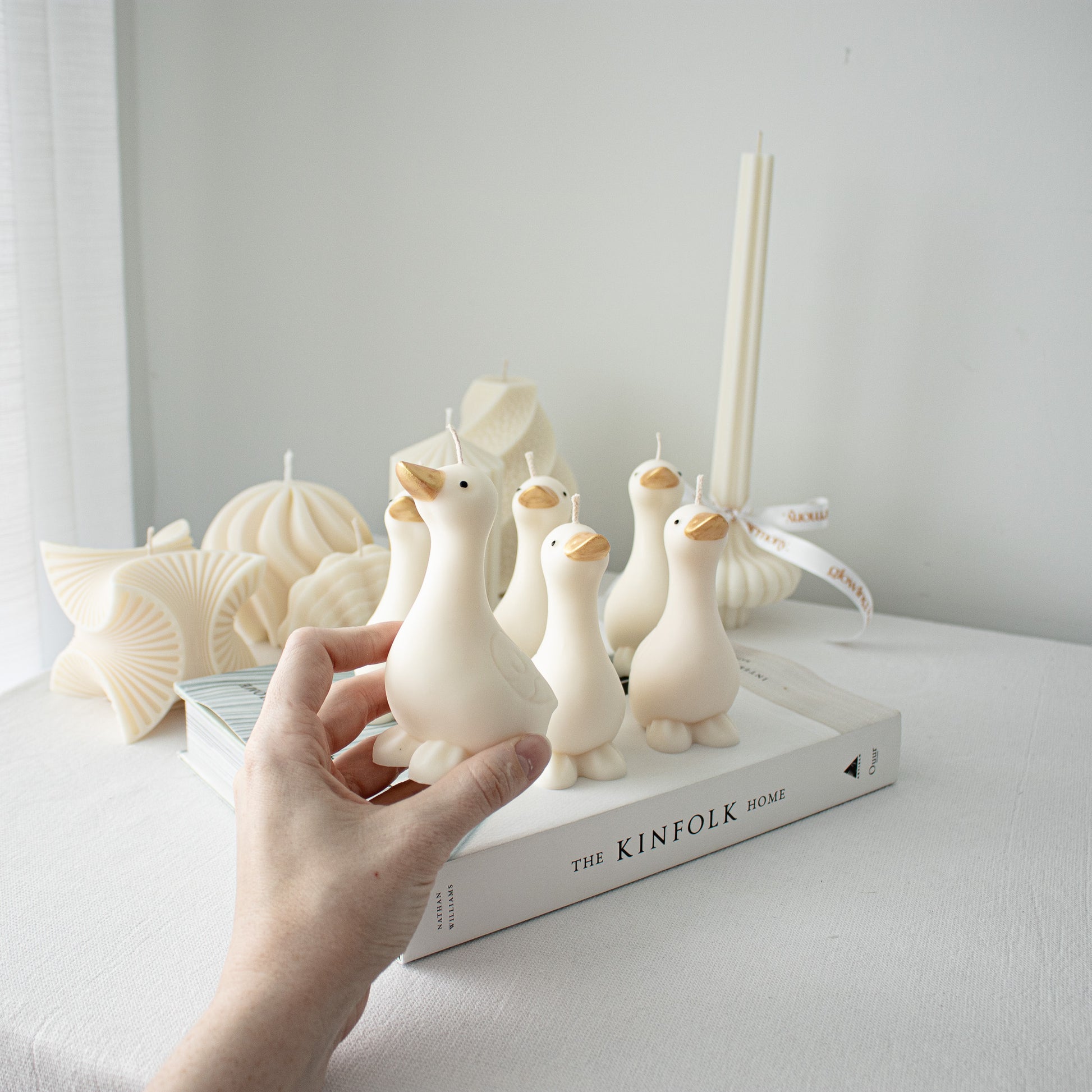 Goose shaped candles handcrafted with detailed painted features, whimsical farm inspired decor